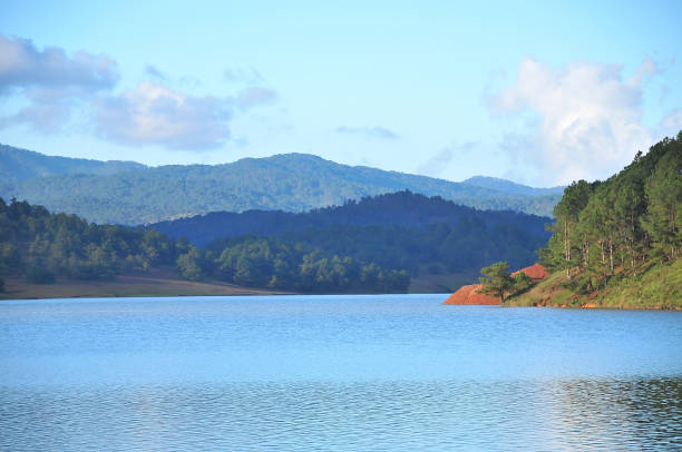 Suoi Vang Lake Leaving the Dalat’s center , coming to Lac Duong,the North of Dalat, visitors must overcome a tortuously long road about 12km being surrounded with pine hills before getting to Suoi Vang lake. fang xiang stock pictures, royalty-free photos & images