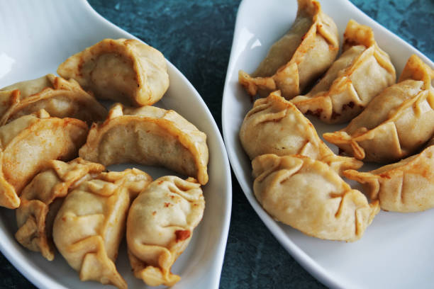 istock Chinese fried pel'menis on two plates 674924486