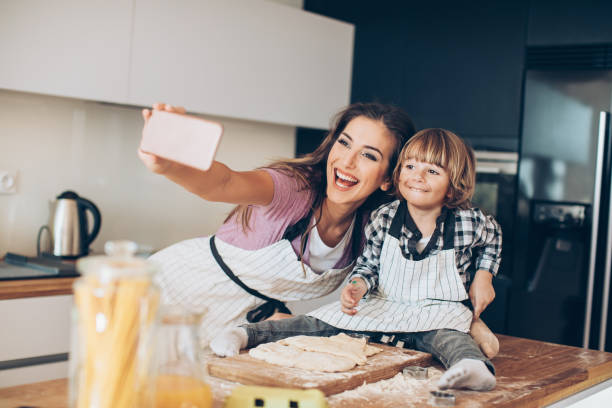 istock Selfie of me and mom making cookies 674930142