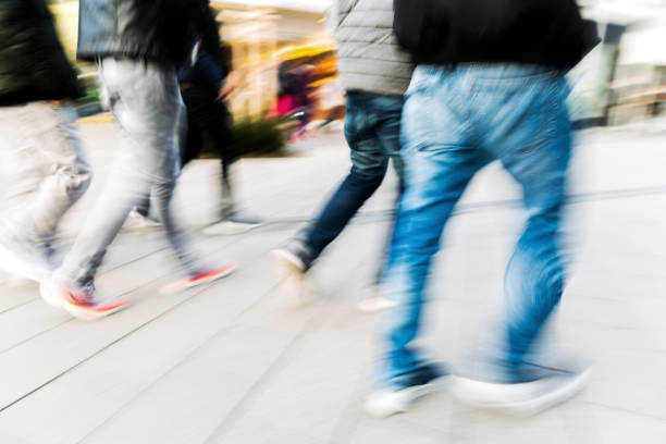 people walking in the city in motion blur