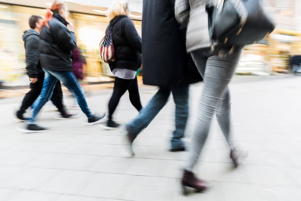 istock people walking in the city in motion blur 674930930