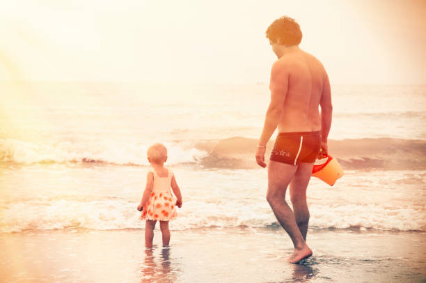 istock Father and His Children at the Beach 674937758
