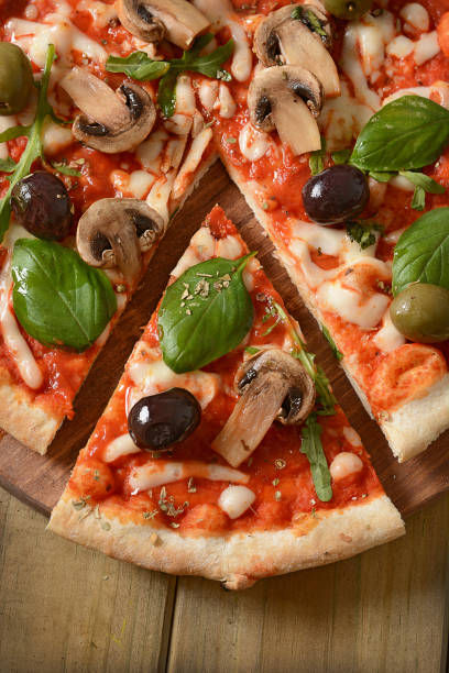 istock Pizza with champignon mushrooms and black olives 674941144