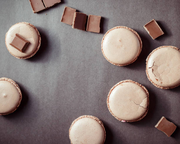 istock Top view of Chocolate pastel brown Macarons or Macaroons 674945240