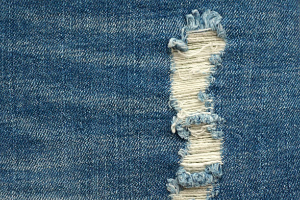 istock Denim blue jeans with stamp and hole, background 674948570