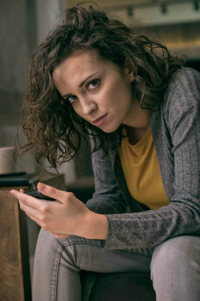 istock Frustrated woman texting on cell phone 674951268