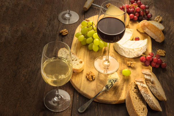 istock Wine and cheese tasting with bread and grapes 674952138