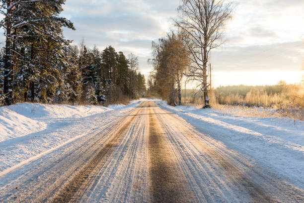 istock empty road in the countryside in winter 674953120