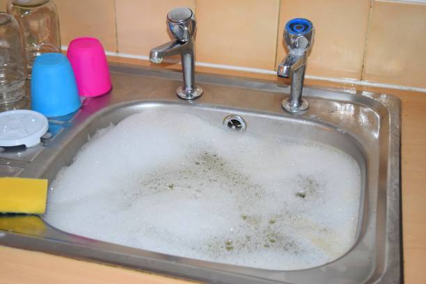 istock washing up cleaning kitchen sink 674958746