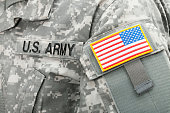 Close up studio shot of USA flag and U.S. ARMY patch on solders uniform