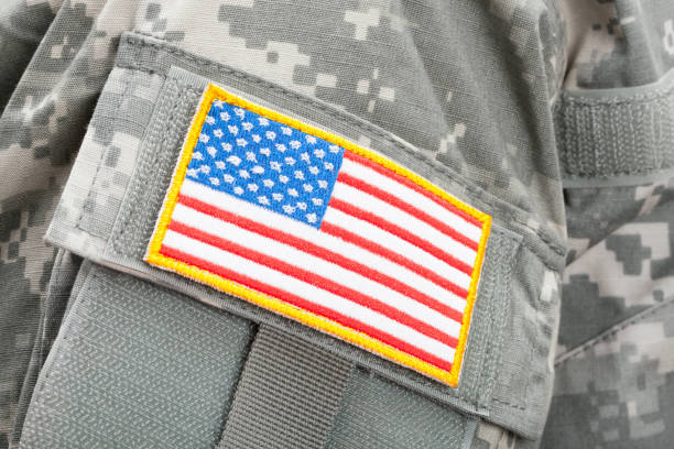 istock Close up studio shot of U.S. flag patch on solders uniform 674959916