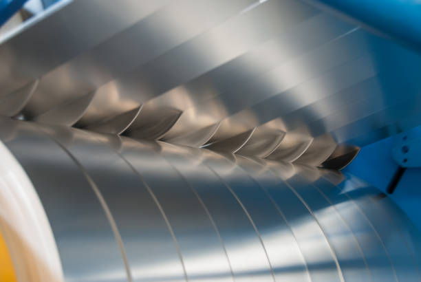 istock Sheet metal strips exiting the slitting line 674963078