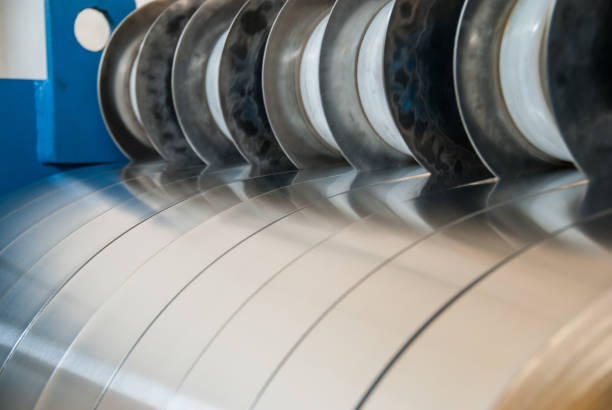 istock Sheet metal strips exiting the slitting line 674963330