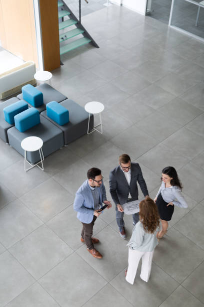 istock Group of business people collaborating and working on project as team 674970666