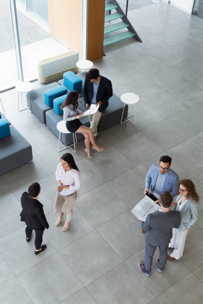 istock Group of business people collaborating and working on project as team 674970674