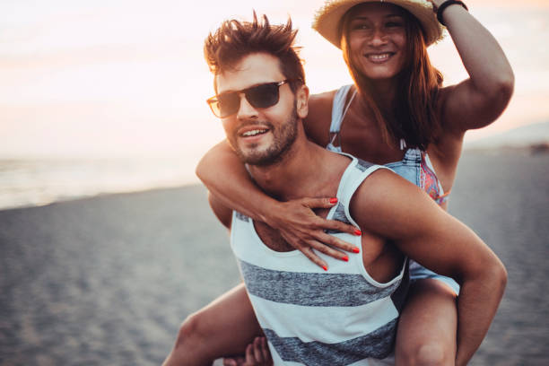 istock Boyfriend carrying girl on his back 674972982