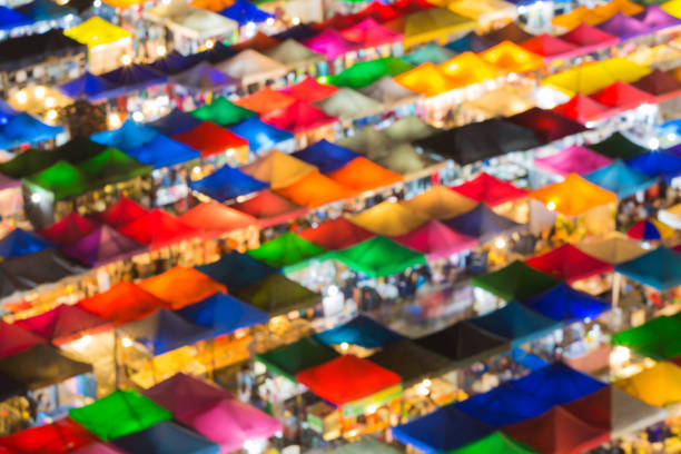 istock Blurred bokeh light night market roof top 674980322