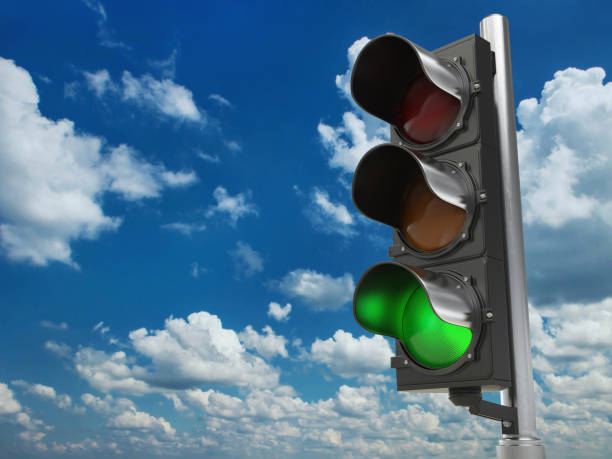istock Traffic light with green color on blue sky background. 674980546