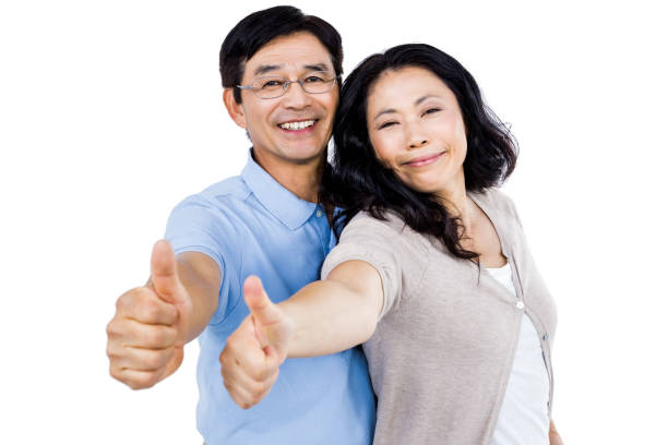 istock Couple standing together with thumbs up 674981476