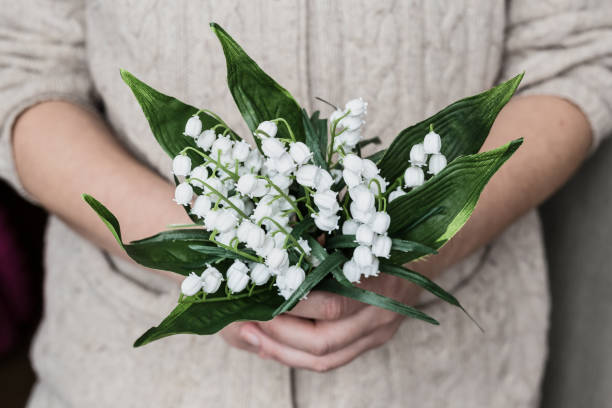 istock Woman hands holding flowers bouquet 674984760