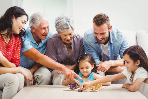 Smiling family playing chess
