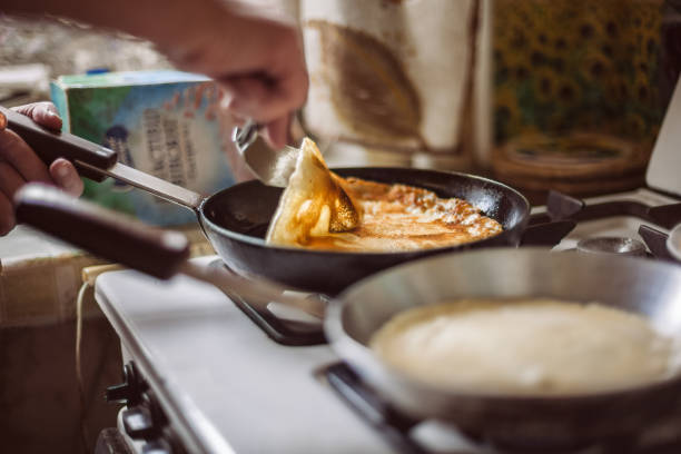 istock Grandmother making pancakes 674994962