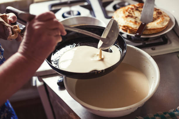 istock Grandmother making pancakes 674995426