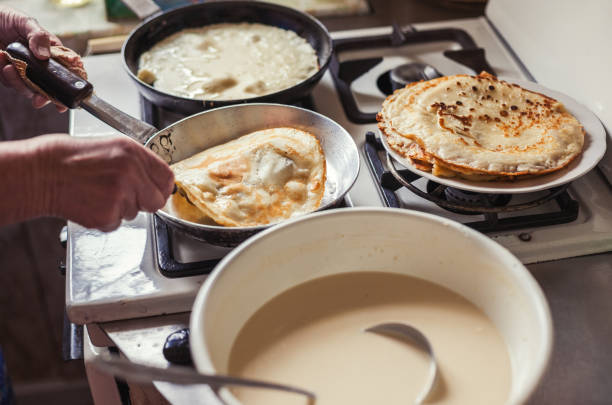istock Grandmother making pancakes 674995442