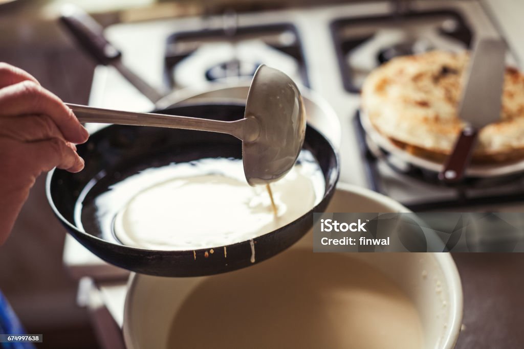 Grandmother making pancakes Pancake Stock Photo