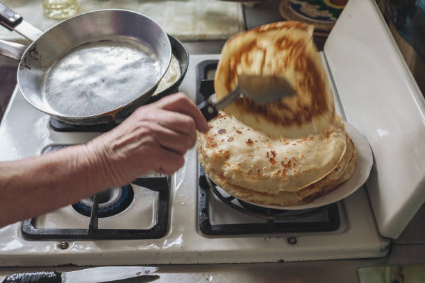 istock Grandmother making pancakes 674998184
