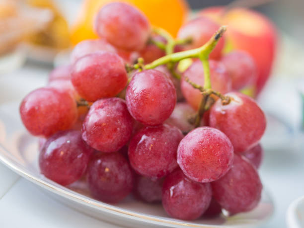 istock Closeup of Red Grapes 674998278