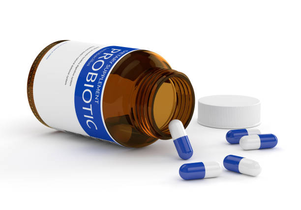 3d render of probiotic pills in bottle over white 3d render of probiotic pills in bottle isolated over white background probiotic stock illustrations