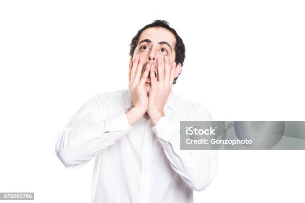 A Man Closing His Mouth With His Big Hands Stock Photo - Download Image Now - Men, Anxiety, Emotional Stress