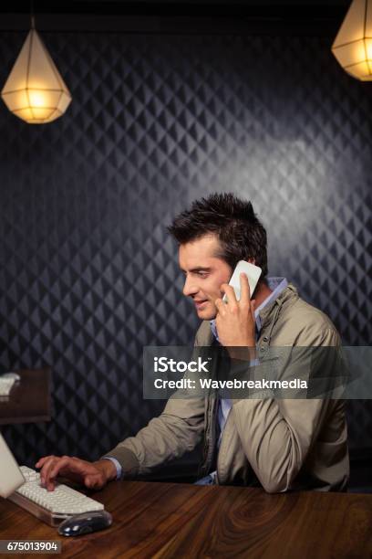 Creative Businessman Using Smartphone Stock Photo - Download Image Now - Animal Call, Telephone, Men