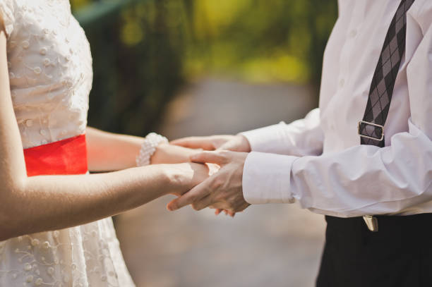istock The couple gently holding each others hands 7818. 675014126