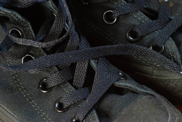 istock Old dirty black sneakers. 675018052