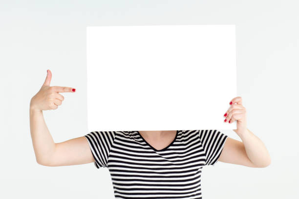 African American woman holding a blank billboard over white background