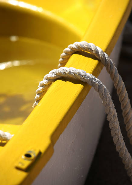 istock Yellow boat with a rope close-up 675036218