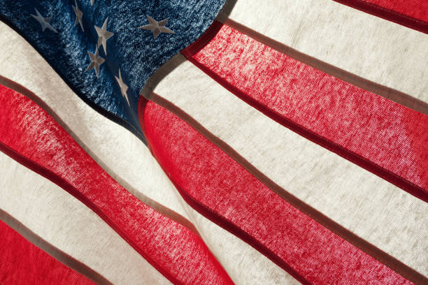 istock Series of ruffled flags against sun - USA 675036456