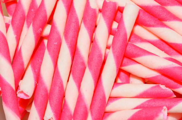wafer rolls wafer rolls filled with strawberry stick pattern ice cream with wafer rolls stock pictures, royalty-free photos & images