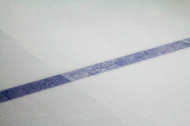 istock Blue line in a hockey rink during ice resurfacing 675041862