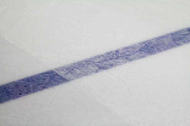 istock Blue line in a hockey rink during ice resurfacing 675041864