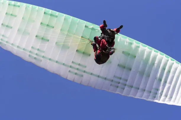 Photo of Paragliding in tandem free gliding and blue sky as background