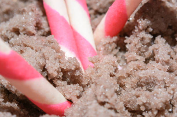 wafer rolls wafer rolls filled with strawberry on ice cream ice cream with wafer rolls stock pictures, royalty-free photos & images