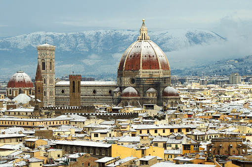 Cathedral Santa Maria del Fiore (Duomo) and giottos bell tower (campanile), in winter with snow in Florence, Tuscany, Italy.