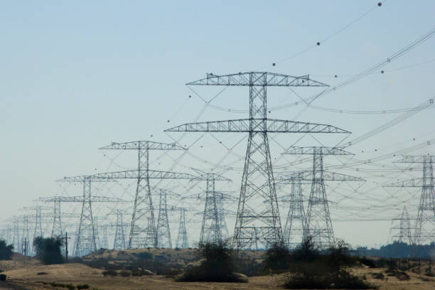 istock Electric transmission lines lead away 675048030
