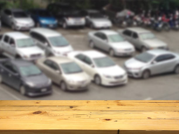 istock Empty wooden table space platform and blurred Parking lot background for product display montage 675049506