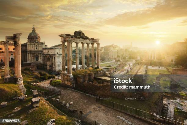 Roman Forum At Sunrise From Left To Right Temple Of Vespasian And Titus Church Of Santi Luca E Martina Septimius Severus Arch Ruins Of Temple Of Saturn Stock Photo - Download Image Now