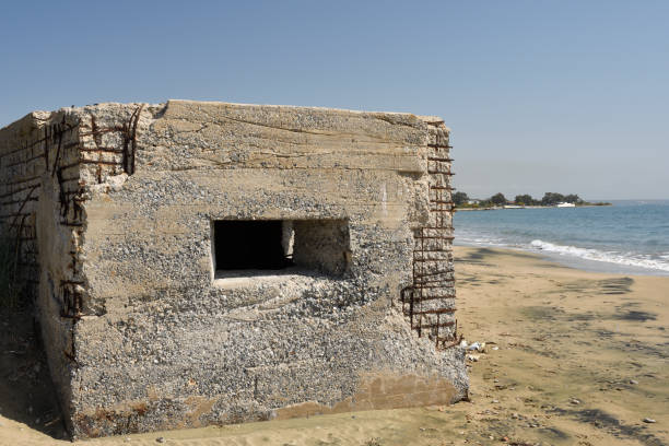 istock Foxhole on the beach with sea and blue sky in background 675052280