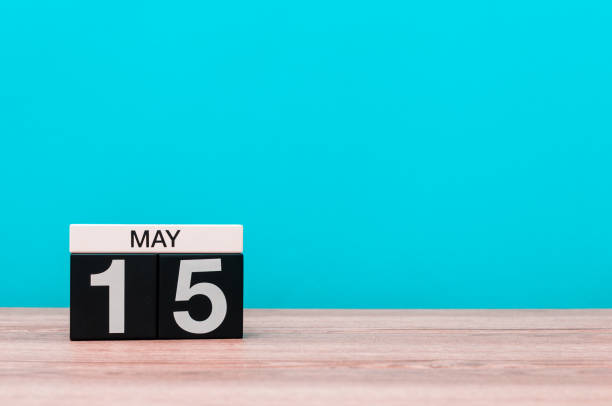 istock May 15th. Day 15 of month, calendar on turquoise background. Spring time, empty space for text. World Remembrance Day Of AIDS Victims 675052352